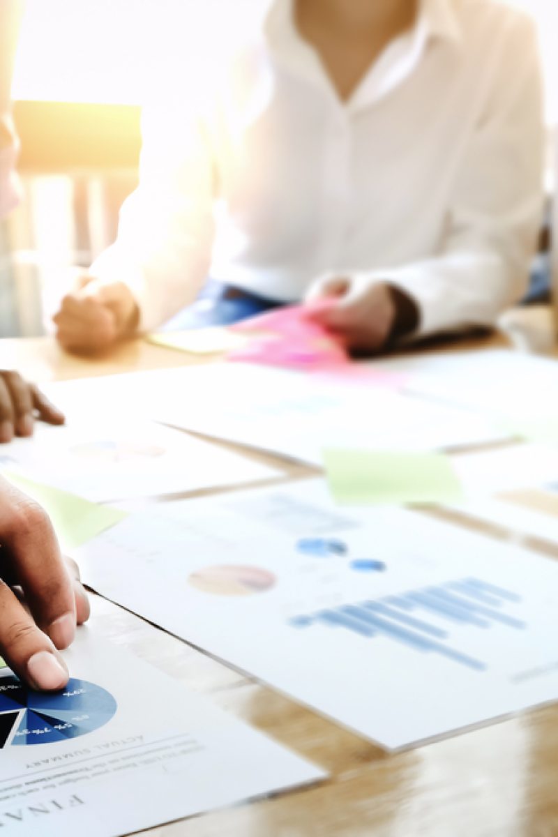 Businessman,Holding,Pens,And,Holding,Graph,Paper,Are,Meeting,To Businessman,Holding,Pens,And,Holding,Graph,Paper,Are,Meeting,To